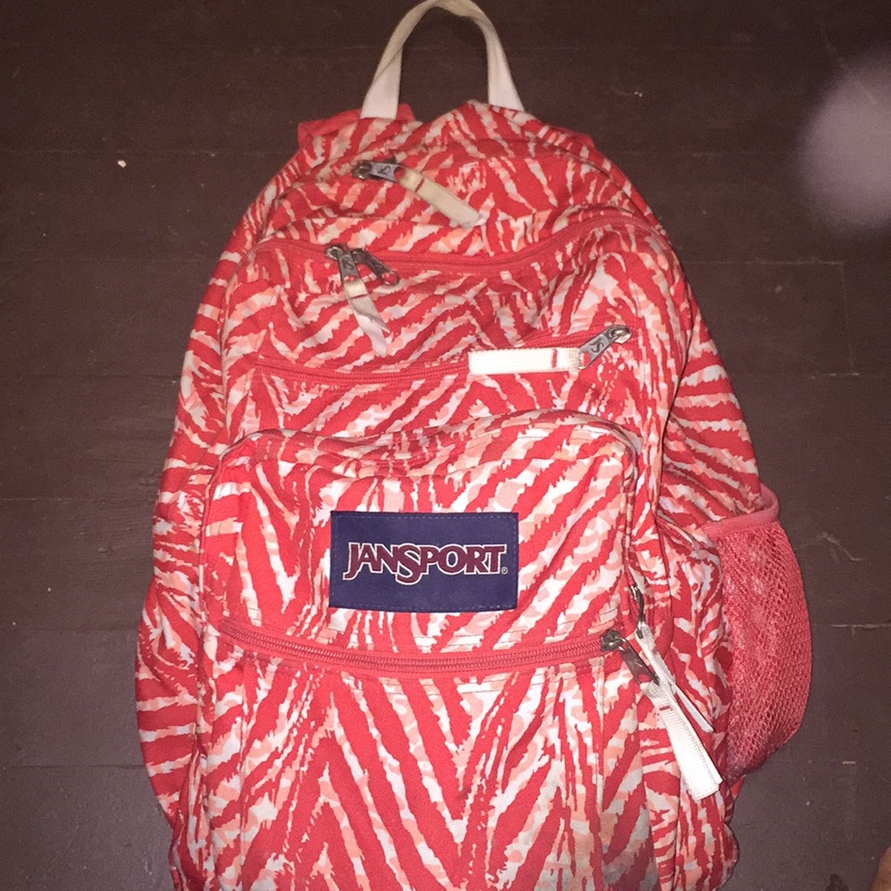Orange salmon color big backpack.